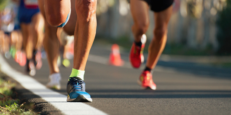 One runner pulls ahead of the others in a race